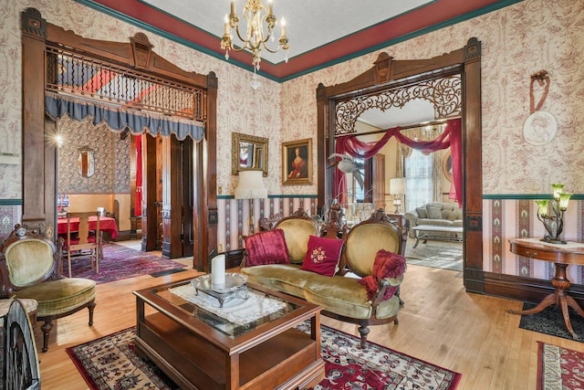 503 E Conant St, Portage, WI 53901 - sitting room featuring wallpapered walls, a chandelier, and wood-type flooring