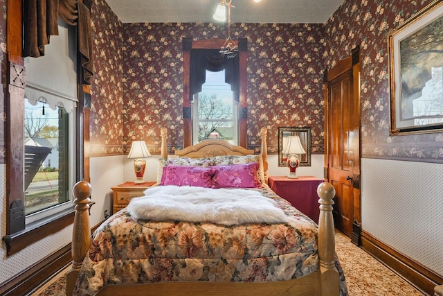 503 E Conant St, Portage, WI 53901 - bedroom featuring wallpapered walls and a wainscoted wall