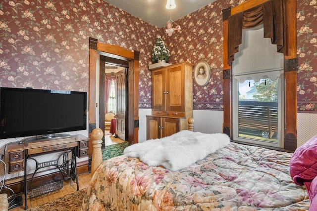 503 E Conant St, Portage, WI 53901 - bedroom with wallpapered walls and light wood-style floors