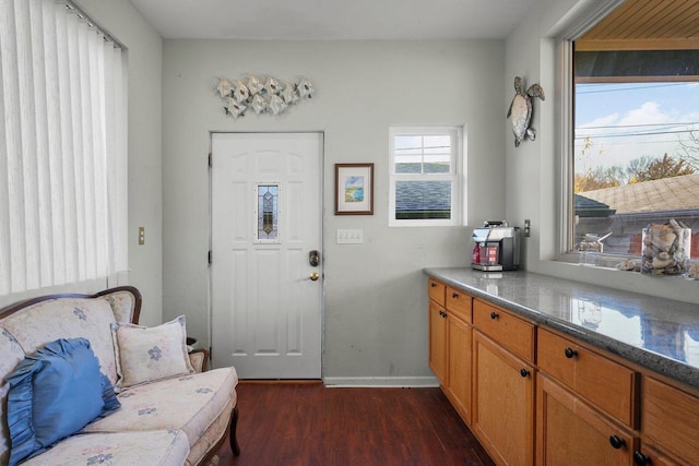 503 E Conant St, Portage, WI 53901 - living area with dark wood-type flooring and baseboards