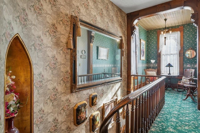 503 E Conant St, Portage, WI 53901 - hall with wallpapered walls, arched walkways, and carpet