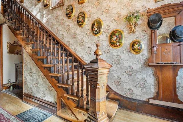 503 E Conant St, Portage, WI 53901 - staircase with wallpapered walls and wood finished floors