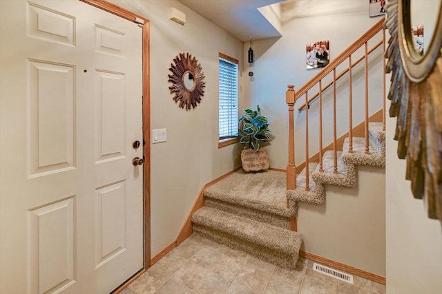 5438 Park Meadow Dr, Madison, WI 53704 - foyer featuring stairs and baseboards