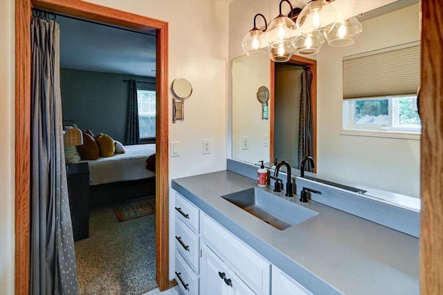5438 Park Meadow Dr, Madison, WI 53704 - ensuite bathroom featuring vanity and a chandelier