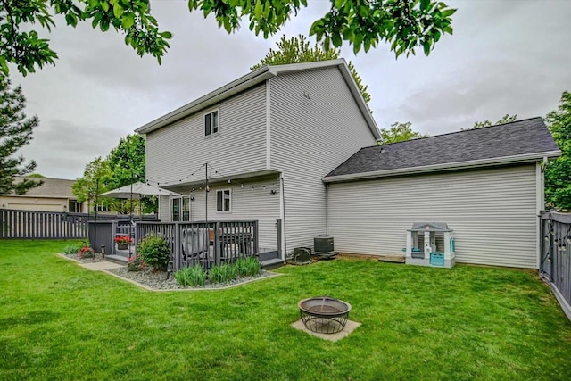 5438 Park Meadow Dr, Madison, WI 53704 - rear view of property featuring central AC unit, a wooden deck, and a fire pit
