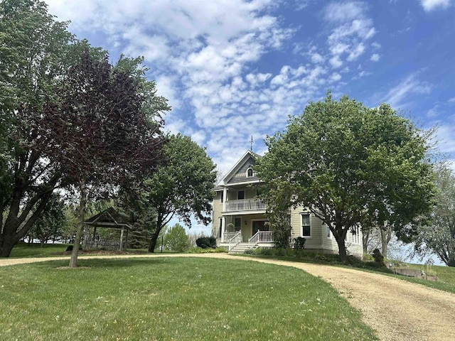 13412 Glacier Rd, Tomah, WI 54660 - view of front of house featuring a gazebo, a front lawn, covered porch, and a balcony