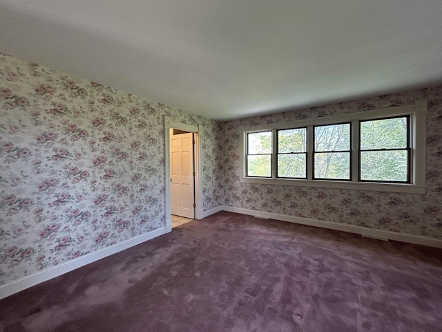 13412 Glacier Rd, Tomah, WI 54660 - unfurnished room with baseboards, carpet flooring, and wallpapered walls