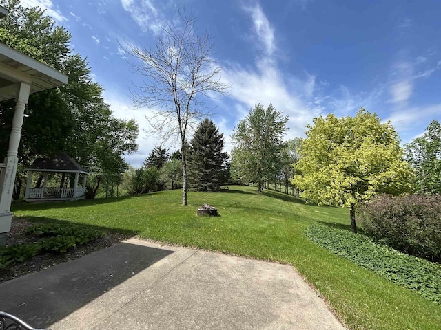 13412 Glacier Rd, Tomah, WI 54660 - view of green lawn featuring a gazebo and a patio area