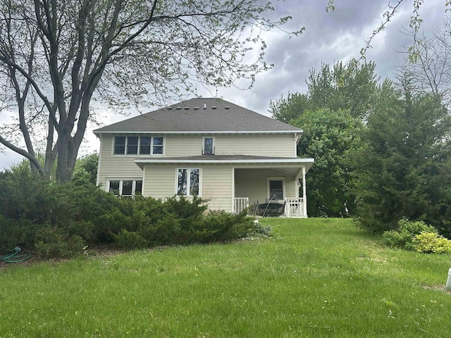 13412 Glacier Rd, Tomah, WI 54660 - rear view of house featuring a lawn and covered porch