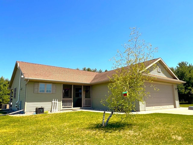 N3480 Feathers Ct, Waupaca, WI 54981 - ranch-style home featuring an attached garage, a front yard, concrete driveway, and central AC