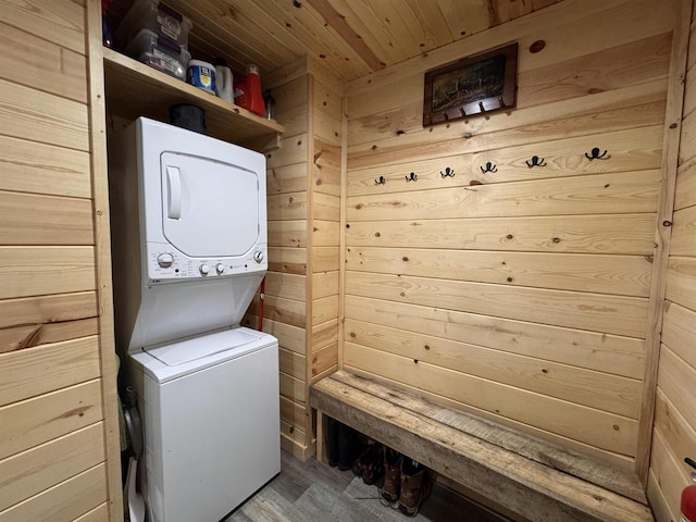 N4755 11th Dr, Montello, WI 53949 - laundry area featuring stacked washer / dryer, wood ceiling, wooden walls, and wood finished floors