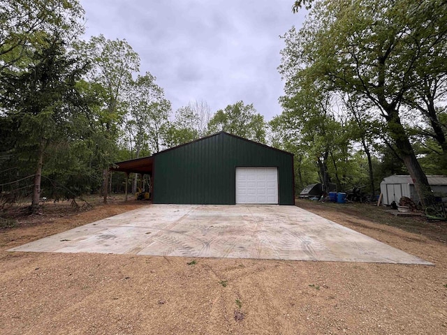 N4755 11th Dr, Montello, WI 53949 - garage featuring driveway and a garage