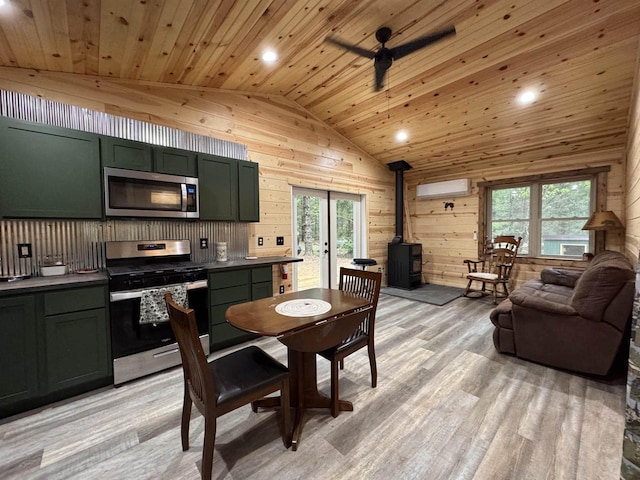 N4755 11th Dr, Montello, WI 53949 - dining space featuring a wood stove, lofted ceiling, wooden ceiling, wood walls, and an AC wall unit