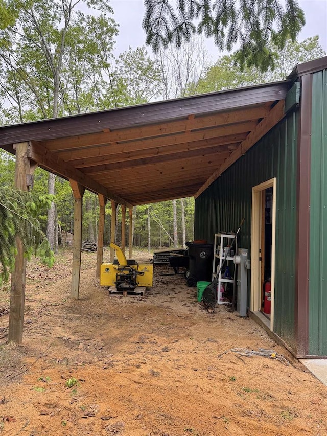 N4755 11th Dr, Montello, WI 53949 - view of parking featuring an attached carport