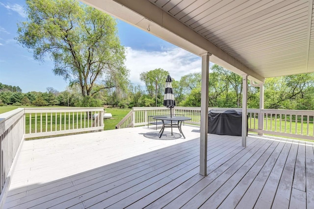 W6870 Czech Ln, Neshkoro, WI 54960 - wooden terrace featuring outdoor dining area, a yard, and view of wooded area