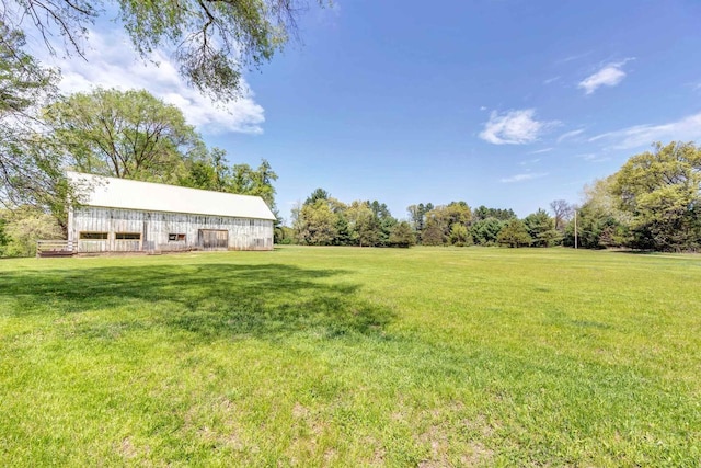 W6870 Czech Ln, Neshkoro, WI 54960 - view of green lawn featuring an outdoor structure