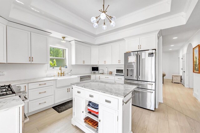 W6870 Czech Ln, Neshkoro, WI 54960 - kitchen featuring appliances with stainless steel finishes, a chandelier, a tray ceiling, white cabinetry, and recessed lighting