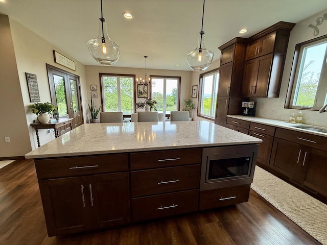 515 Fieldstone Ct, Tomah, WI 54660 - kitchen featuring a sink, healthy amount of natural light, recessed lighting, and dark wood-style floors