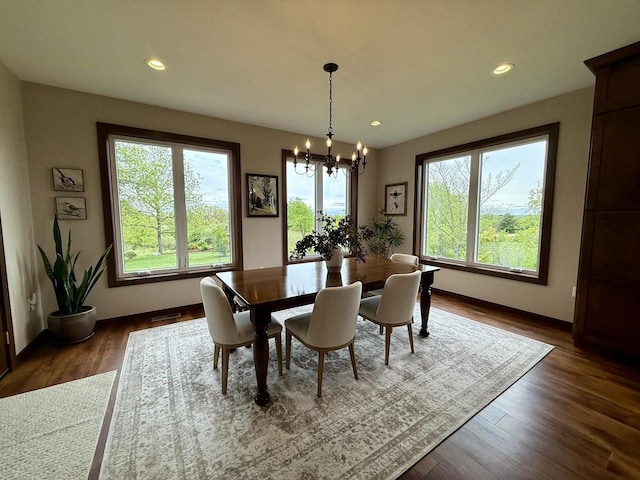 515 Fieldstone Ct, Tomah, WI 54660 - dining area featuring a chandelier, recessed lighting, baseboards, and dark wood finished floors