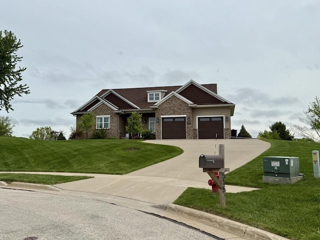 515 Fieldstone Ct, Tomah, WI 54660 - craftsman-style house with a front lawn, driveway, a garage, and stone siding