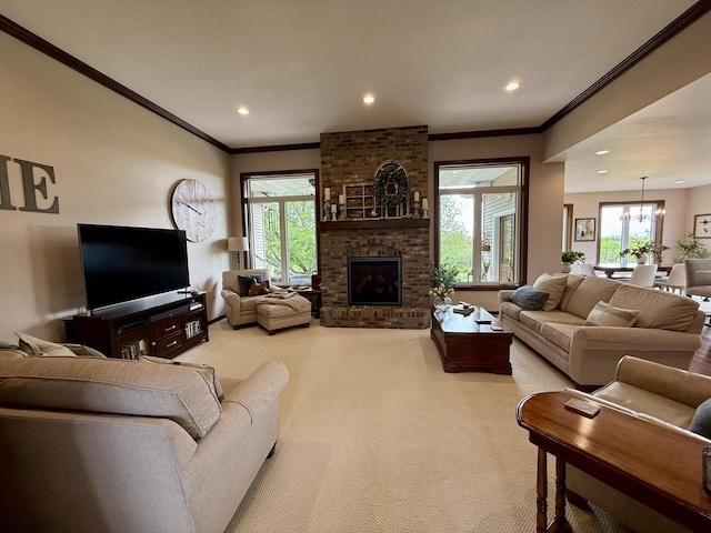 515 Fieldstone Ct, Tomah, WI 54660 - carpeted living room featuring ornamental molding, plenty of natural light, recessed lighting, a fireplace, and a chandelier