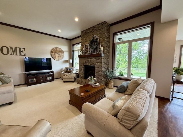 515 Fieldstone Ct, Tomah, WI 54660 - living room with ornamental molding, healthy amount of natural light, baseboards, a fireplace, and recessed lighting