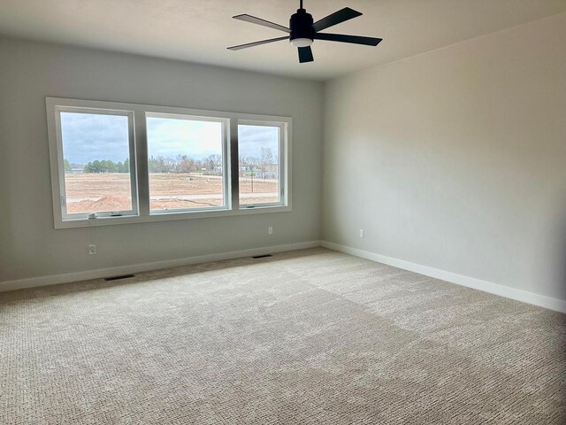365 N Wilson St, Kimberly, WI 54136 - empty room featuring baseboards, light carpet, and ceiling fan