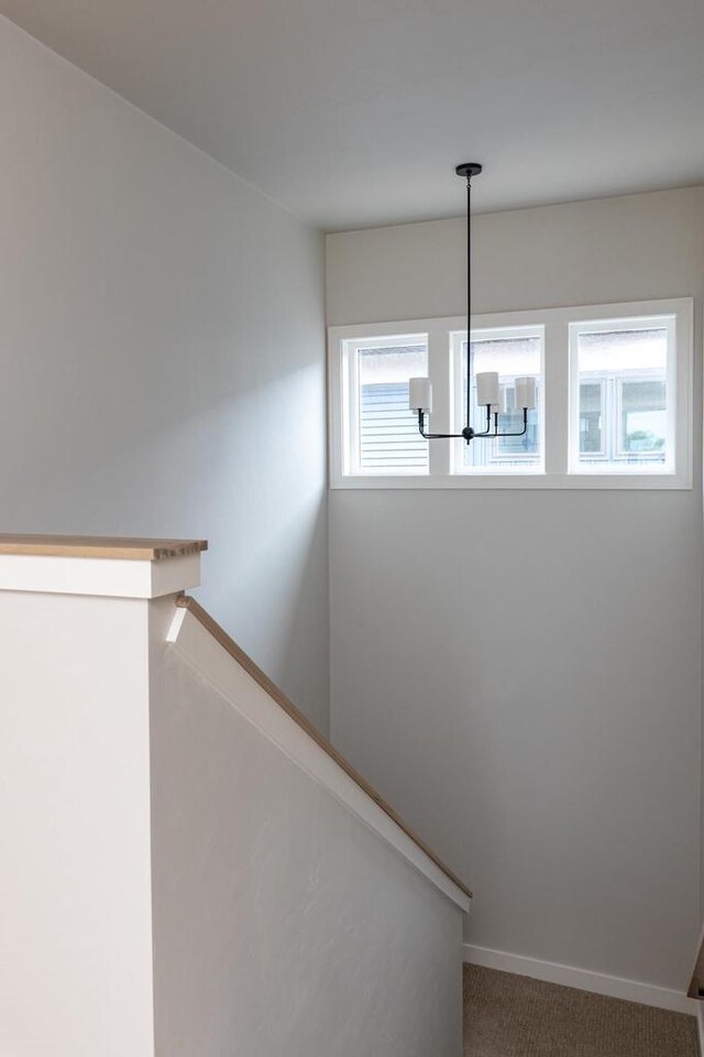 365 N Wilson St, Kimberly, WI 54136 - stairs featuring a chandelier, carpet, and baseboards