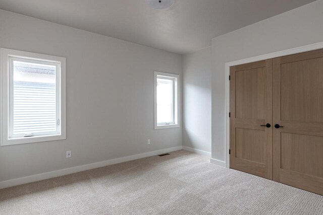 365 N Wilson St, Kimberly, WI 54136 - unfurnished bedroom featuring baseboards, carpet floors, and a closet