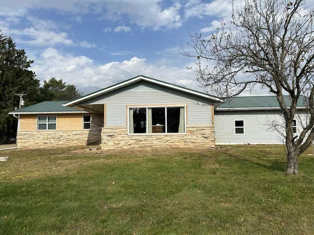 188 County Rd N, Birnamwood, WI 54414 - rear view of house with stone siding and a yard