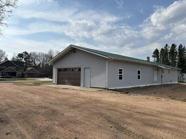 188 County Rd N, Birnamwood, WI 54414 - view of home's exterior with a garage