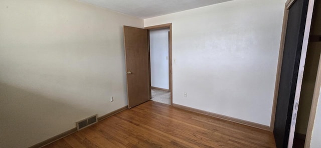 2905 S 18th St, Sheboygan, WI 53081 - empty room with wood finished floors and baseboards