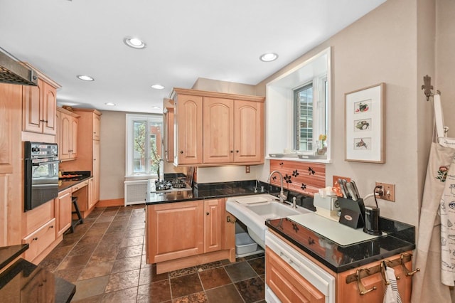 1830 E Kane Pl Unit 3, Milwaukee, WI 53202 - kitchen with light brown cabinets, black oven, recessed lighting, and dark countertops