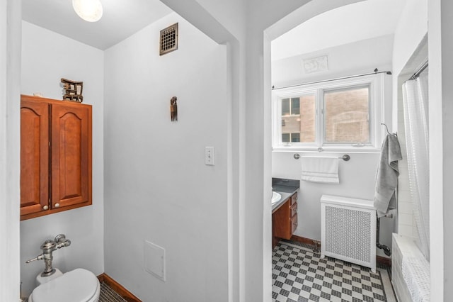 1830 E Kane Pl Unit 3, Milwaukee, WI 53202 - full bathroom featuring radiator heating unit, tile patterned floors, a shower with shower curtain, and toilet