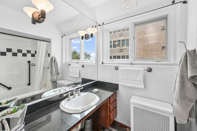1830 E Kane Pl Unit 3, Milwaukee, WI 53202 - bathroom featuring a shower with shower curtain, vaulted ceiling, vanity, radiator heating unit, and toilet