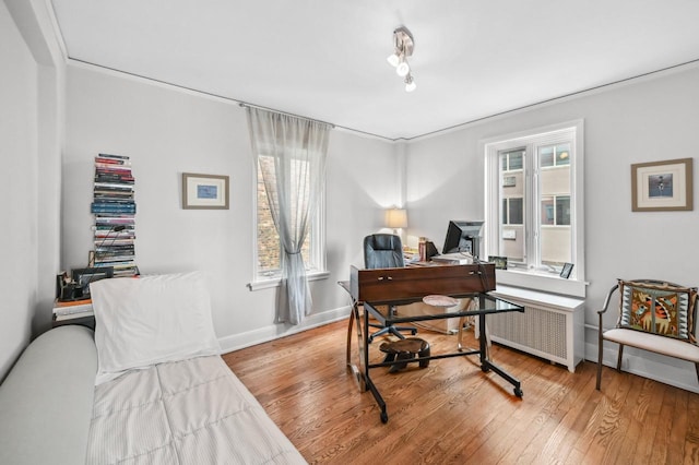 1830 E Kane Pl Unit 3, Milwaukee, WI 53202 - office area with wood finished floors, radiator, and baseboards