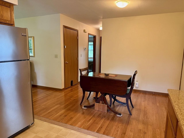 W9519 Skogen Rd, Cambridge, WI 53523 - dining space featuring light wood-type flooring and baseboards