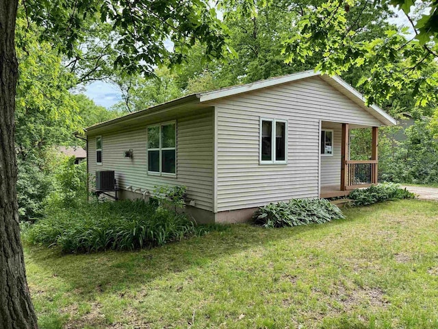 W9519 Skogen Rd, Cambridge, WI 53523 - view of property exterior featuring a yard and central air condition unit