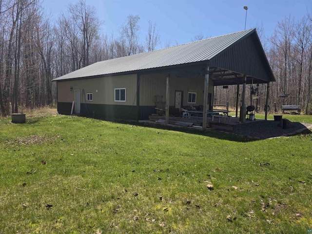 2284 Spirit Ln, La Pointe, WI 54850 - view of property exterior featuring a lawn and metal roof