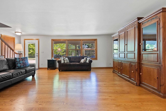 430 Fairview Way, Shawano, WI 54166 - living room with light wood-type flooring, stairs, healthy amount of natural light, and baseboards