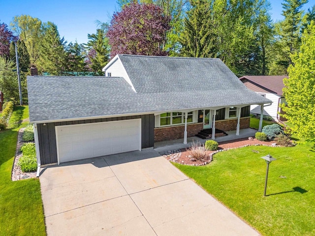 430 Fairview Way, Shawano, WI 54166 - view of front of property with a shingled roof, a garage, board and batten siding, a front yard, and concrete driveway