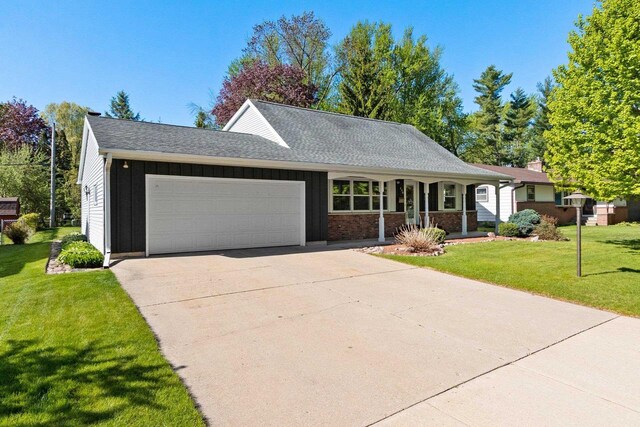 430 Fairview Way, Shawano, WI 54166 - ranch-style house with a garage, board and batten siding, a front lawn, driveway, and a porch