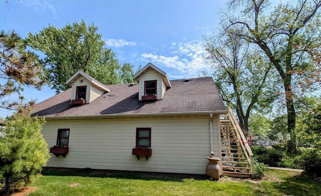 109 Doty St, Fremont, WI 54940 - view of property exterior with stairway, a yard, and roof with shingles
