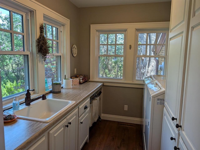 109 Doty St, Fremont, WI 54940 - kitchen with white cabinetry, a sink, dark wood-type flooring, baseboards, and light countertops