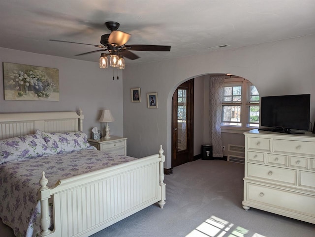 109 Doty St, Fremont, WI 54940 - bedroom with arched walkways, light colored carpet, and a ceiling fan