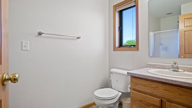 13213 138th Ave, Chippewa Falls, WI 54729 - bathroom with vanity, a shower stall, and toilet