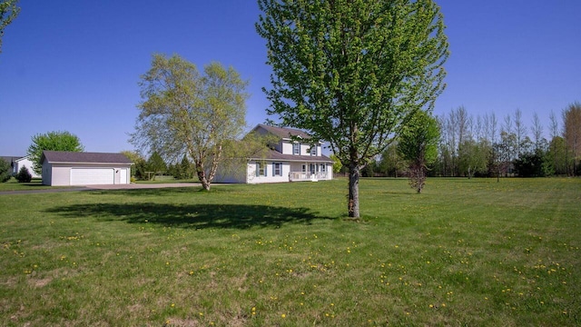 13213 138th Ave, Chippewa Falls, WI 54729 - view of green lawn featuring driveway and an attached garage