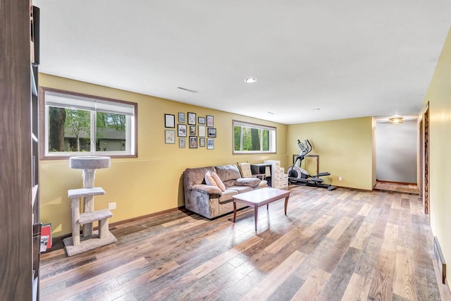600 Honey Bear Ct, Waupaca, WI 54981 - living area featuring wood finished floors, baseboards, and recessed lighting