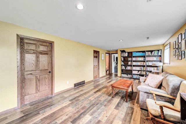 600 Honey Bear Ct, Waupaca, WI 54981 - living area with wood finished floors, recessed lighting, and baseboards