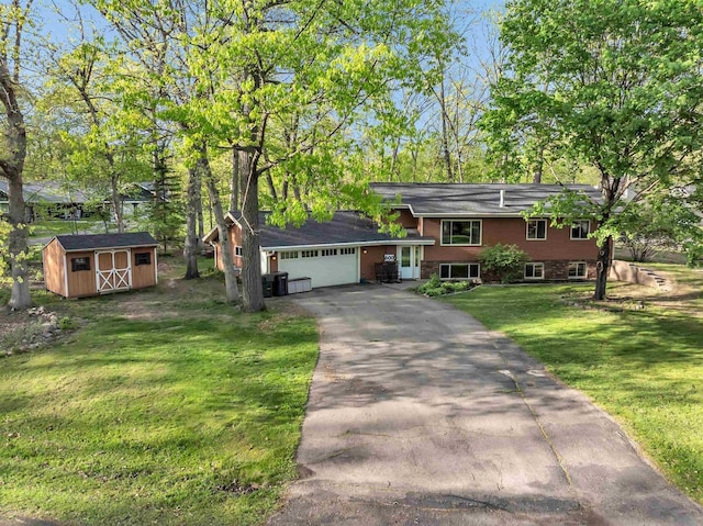 600 Honey Bear Ct, Waupaca, WI 54981 - split level home with asphalt driveway, a front lawn, and a garage